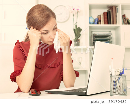 Sad woman crying in office Sad woman crying in office 29170482