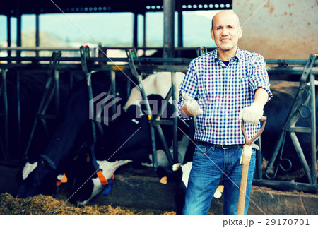 Male farmer holding agricultural tool Male farmer holding agricultural tool 29170701