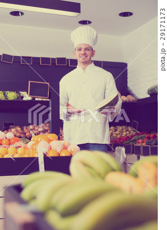 Handsome male chef looking for fresh fruits Handsome male chef looking for fresh fruits 29171173