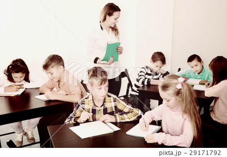 Boys and girls with teacher drawing Boys and girls with teacher drawing 29171792
