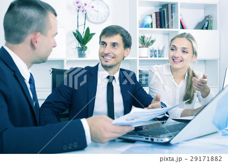 Coworkers chatting about business project Coworkers chatting about business project 29171882