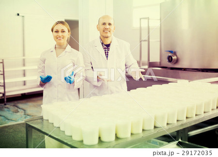 Workers working on cottage cheese 29172035