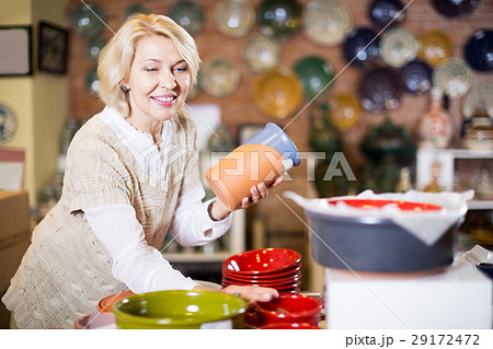 Woman posing with ceramic tableware Woman posing with ceramic tableware 29172472