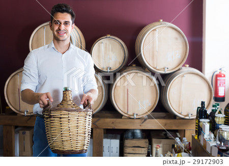 man holding large wine bottle man holding large wine bottle 29172903