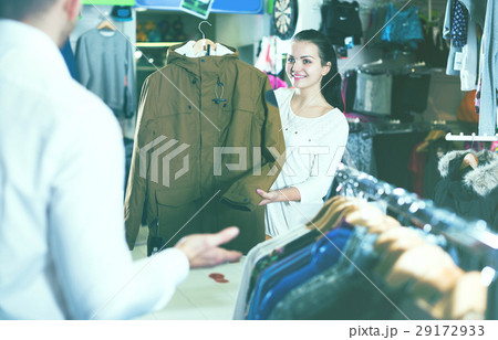 Couple choosing new coat 29172933