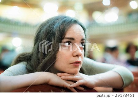 Portrait of bored woman looking theatre performance 29173451