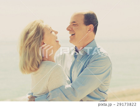 Happy aged lovers laughting outdoor Happy aged lovers laughting outdoor 29173822