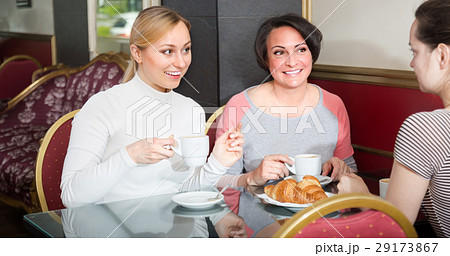 Female friends in the cafeteria. Female friends in the cafeteria. 29173867