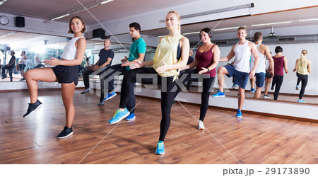 Men and ladies dancing zumba 29173890