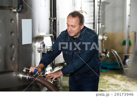 Man estimates operation of equipment Man estimates operation of equipment 29173946