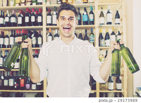 man buying bottle of wine man buying bottle of wine 29173989