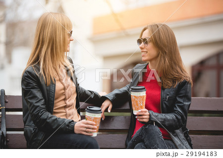 Portrait of two beautiful young girlfriends with 29194183