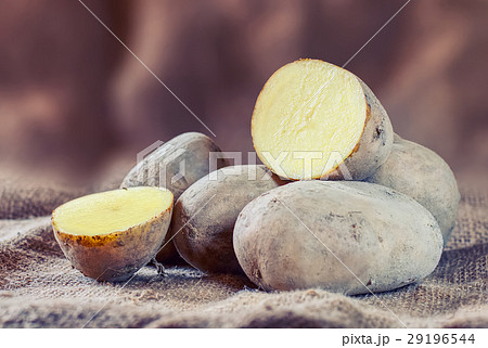 New raw potatoes on a rustic background. 29196544