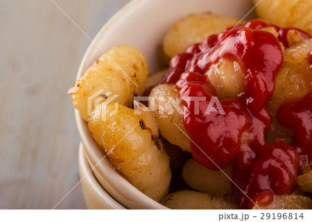 Detail of homemade gnocchi in bowls with ketchup 29196814