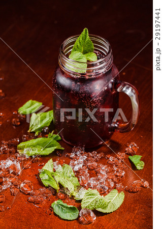 Coctail in a glass with black currant 29197441