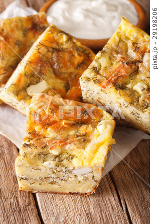 Serbian pie Gibanica with cheese, eggs and greens Serbian pie Gibanica with cheese, eggs and greens 29198206