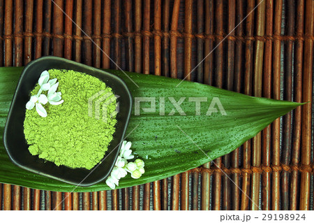 Spa background. White flower, green spa mud Spa background. White flower, green spa mud 29198924