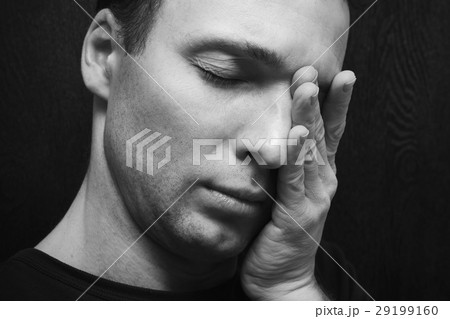 Young stressed Caucasian man closeup 29199160