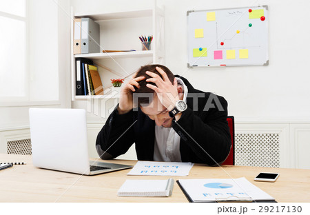 Young concentrated businessman with laptop in Young concentrated businessman with laptop in 29217130