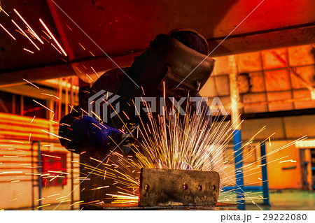 Worker welding automotive part in factory Worker welding automotive part in factory 29222080