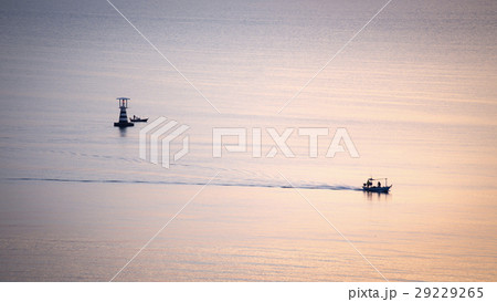 silhouette sunrise of fishery boat sail calm sea  29229265