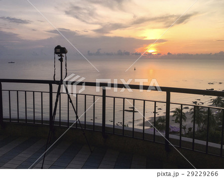 camera take sunrise picture over sea and beach  29229266