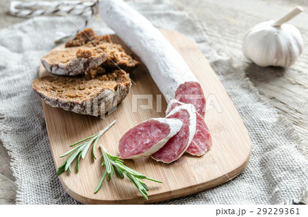 Slices of spanish salami on the sackcloth 29229361