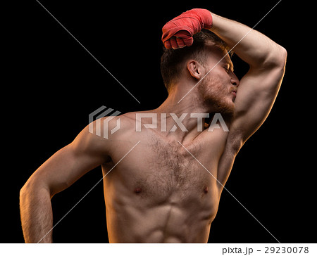Muscular man kissing biceps Muscular man kissing biceps 29230078