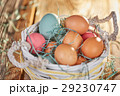Easter basket with colored easter eggs 29230747