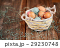 Easter basket with colored easter eggs 29230748