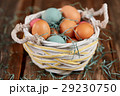 Easter basket with colored easter eggs 29230750