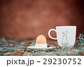 Egg in eggcup and cup of coffee for breakfast 29230752