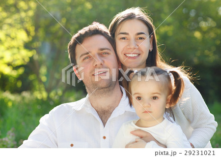 Happy young family with baby girl Happy young family with baby girl 29231021