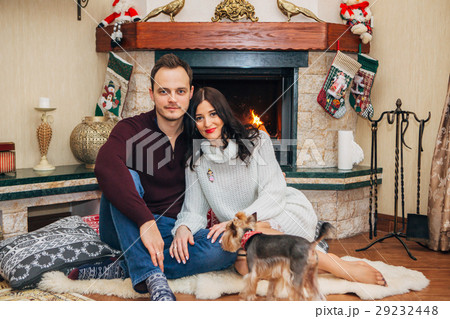 beautiful couple in love near fireplace 29232448