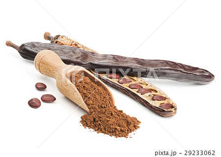 Carob powder and pods isolated on white Carob powder and pods isolated on white 29233062