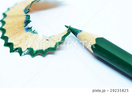 Sharpened green color pencil and wood shavings 29235825