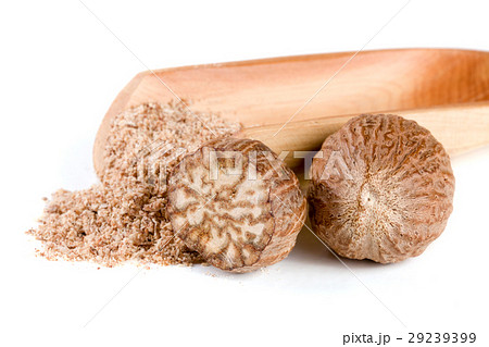 two nutmeg and powder isolated on white background two nutmeg and powder isolated on white background 29239399