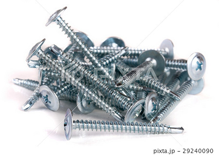 pile of metal screws isolated on white background 29240090