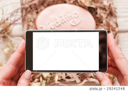Taking photo of dessert by phone. Blank screen. Taking photo of dessert by phone. Blank screen. 29241548