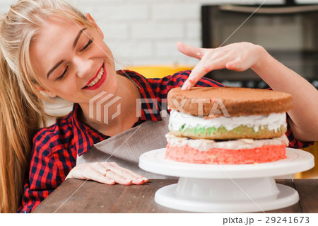 Woman makes a biscuit cake. Sweets for selling. Woman makes a biscuit cake. Sweets for selling. 29241673