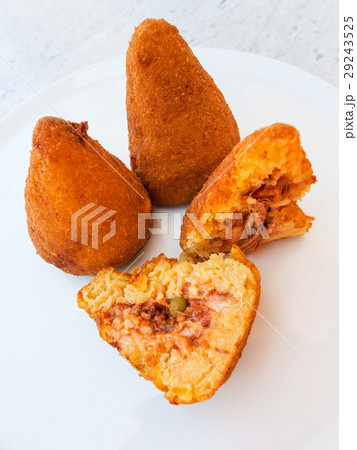 traditional arancini on white plate in Sicily 29243525