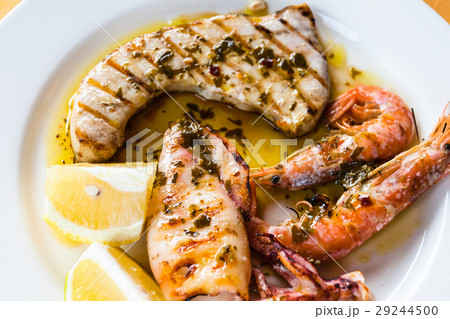 sicilian grilled fish and seafood mix close up sicilian grilled fish and seafood mix close up 29244500