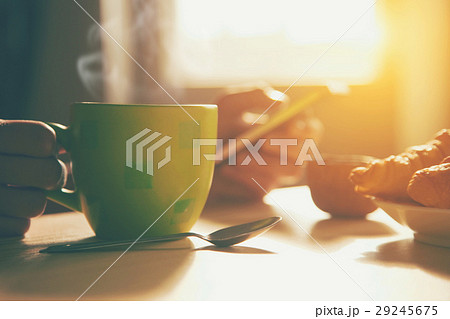 breakfast with coffee and browsing smartphone 29245675