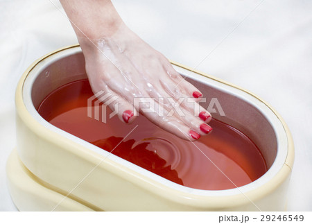 Process paraffin treatment of female hands in beau Process paraffin treatment of female hands in beau 29246549