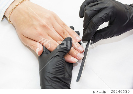 Woman doing manicure beauty salon  29246559