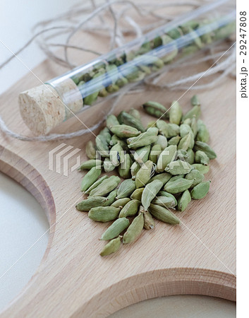 Dry aroma cardamon on the wooden board 29247808