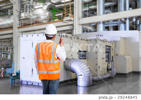 Engineer working in thermal power plant with radio Engineer working in thermal power plant with radio 29248845
