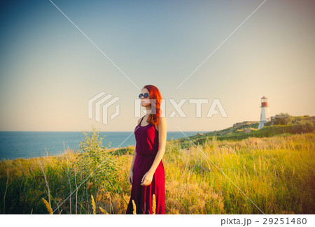 beautiful young woman standing 29251480