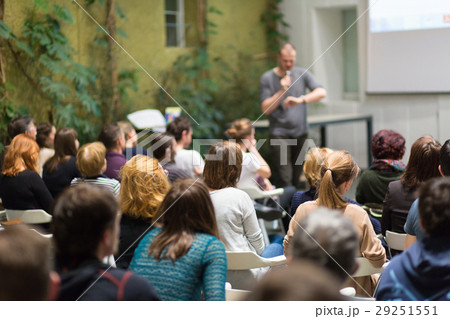 Man giving presentation in lecture hall at 29251551