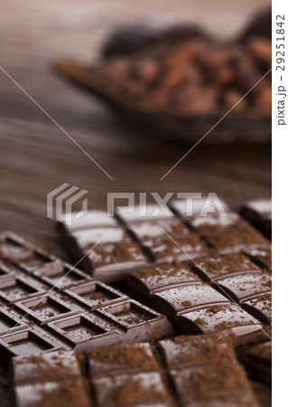 Dark and milk chocolate bar on a wooden table Dark and milk chocolate bar on a wooden table 29251842